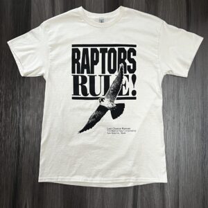 front of cream Raptors Rule shirt